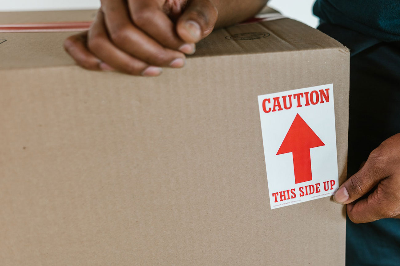 Labeling a Box Containing Fragile Items with A Sticker